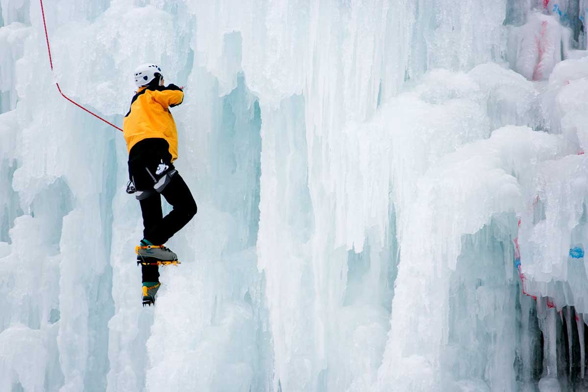man ice climbing during the Ulaanbaatar Winter Festival in Mongolia.