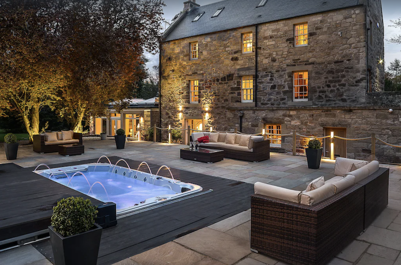 outdoor terrace with hot tub at the Old Millhouse near Edinburgh, Scotland