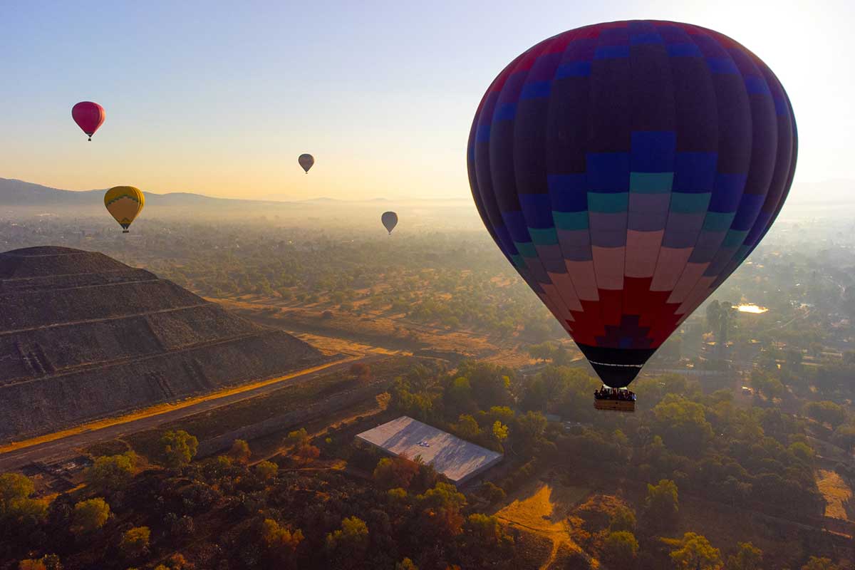Sunrise on hot air balloon over the Teotihuacan pyramid.