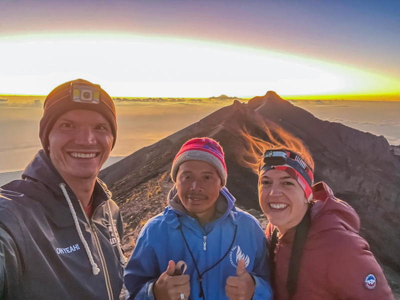 hikers taking a selfie with their Mount Agung trekking guide at the summit