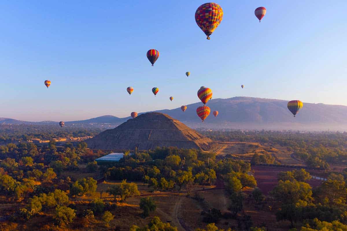 Sunrise on hot air balloon over the Teotihuacan pyramid.