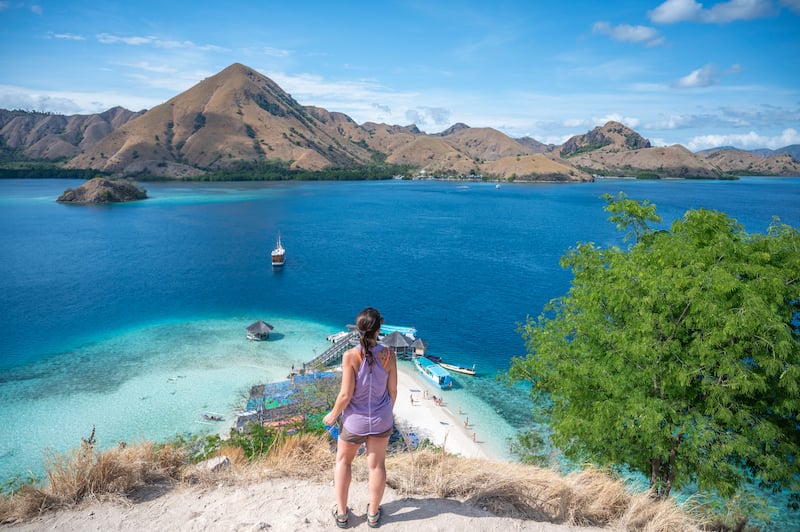 woman gazing out over the Komodo Islands during her 2 week trip to Bali