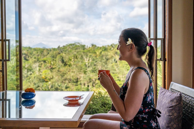 traveler enjoying tropical forest views at Padma Resort in Ubud, Bali