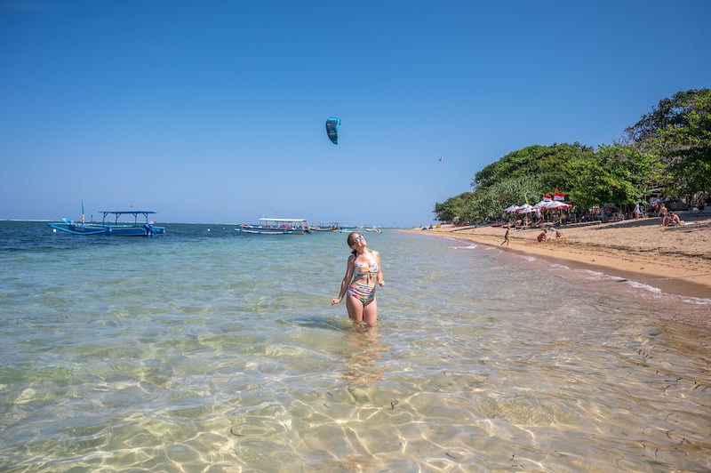 female traveler swimming at Sanur Beach during 2 weeks in Bali