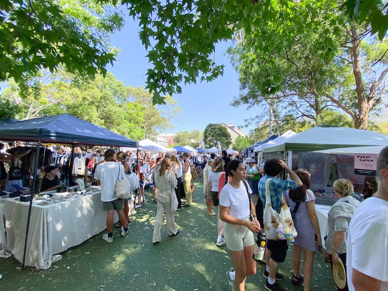 People wandering around the bustling Glebe Market