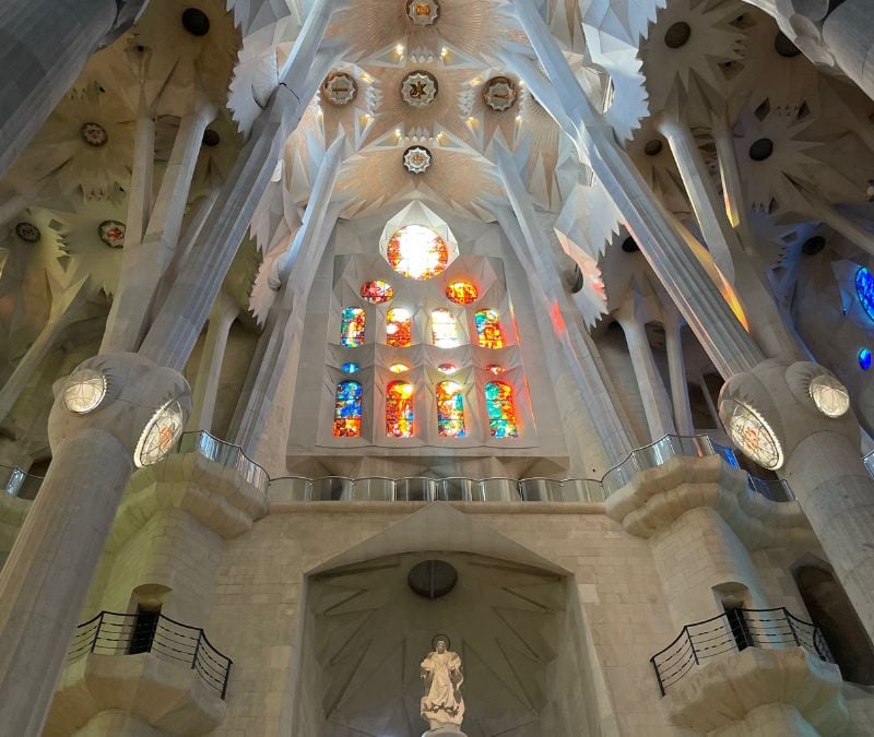 solo female traveler in Spain exploring the interior of the Sagrada Familiar in Barcelona
