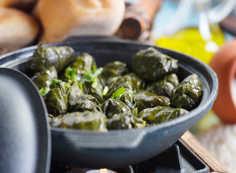 iron pan filled with Greek dolmades