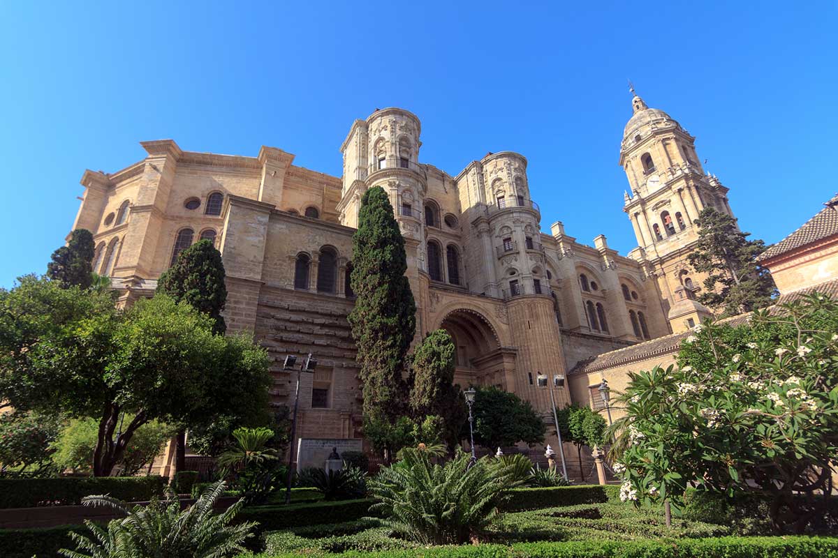 solo traveler in Spain visiting the Malaga Cathedral and gardens