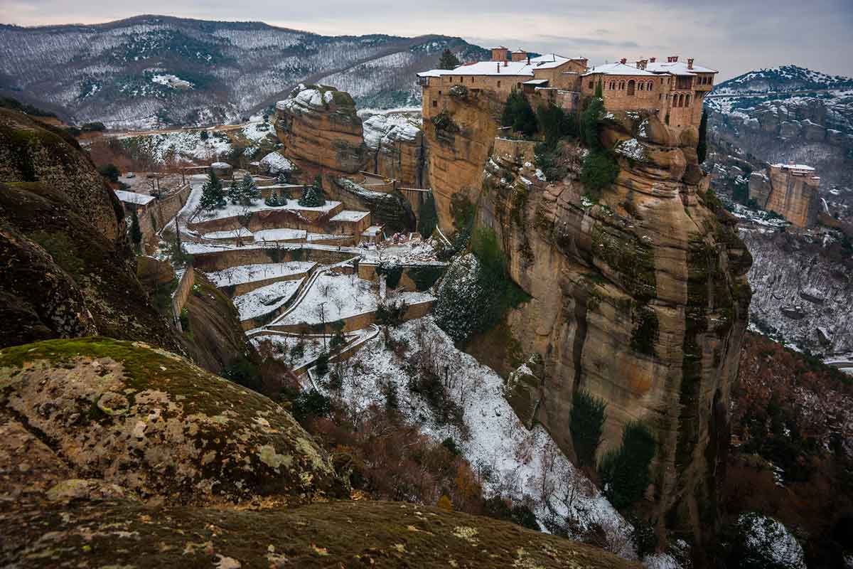 View of the mountains and monasteries of Meteora covered in snow in Greece in winter