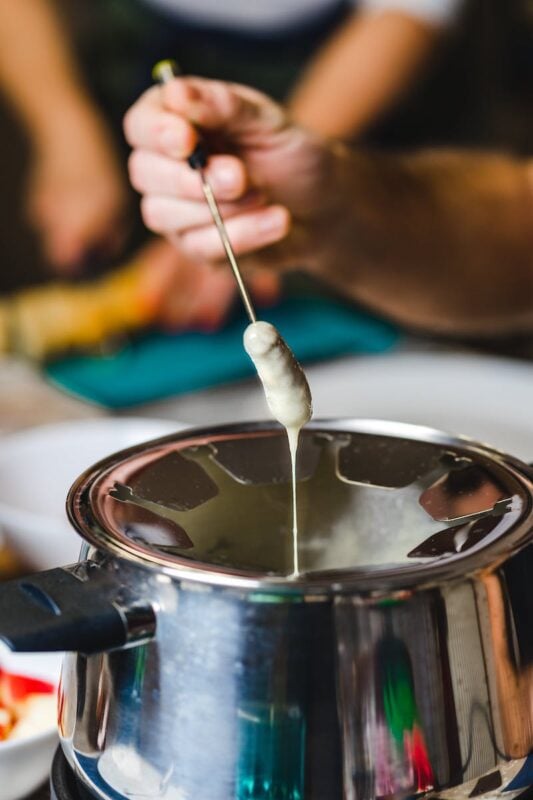 Swiss cheese fondue in a silver pot