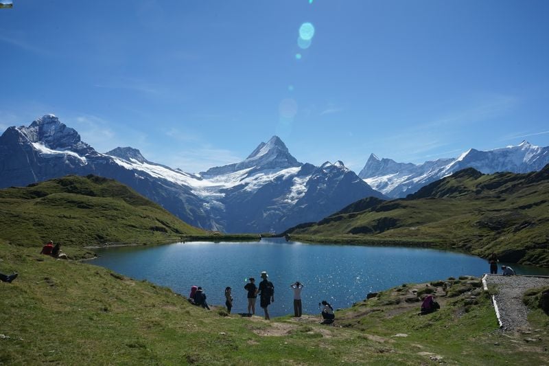 solo traveler in Switzerland visiting the Bachalpsee in Grindelwald