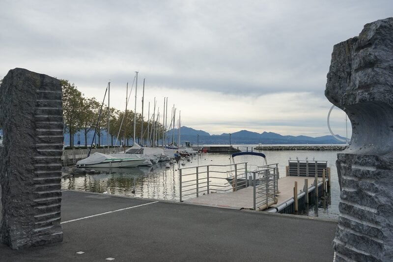 Lausanne Lakefront Promenade with mountains in the background