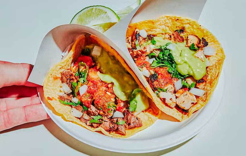 A close up photo of two tacos from Los Tacos No 1 in NYC.