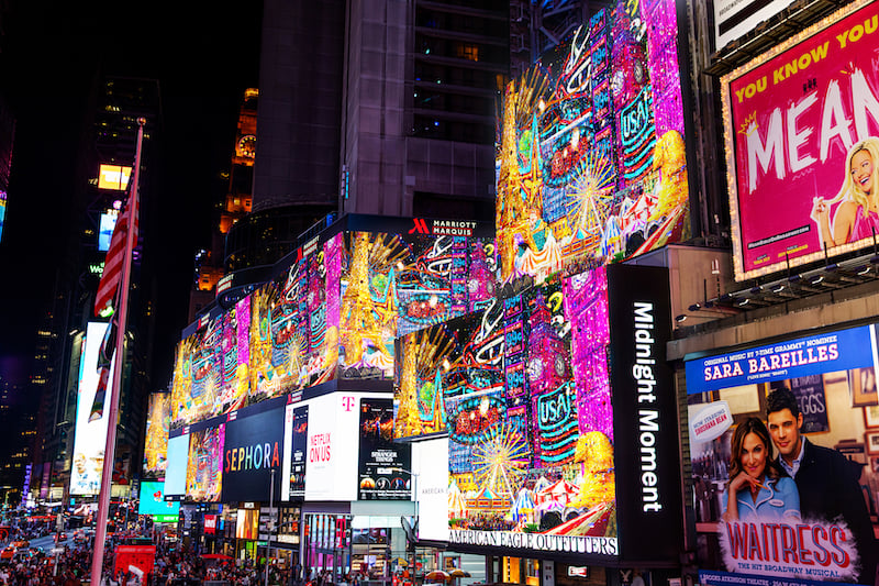 electronic billboards showcasing contemporary art during the Midnight Moment in Times Square New York City