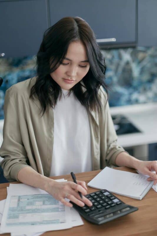 woman planning the cost of hosting a retreat