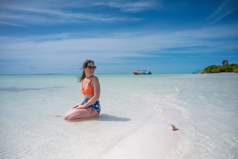 woman sitting in the turquoise waters of the Gulf of Mexico around Isla Holbox, Mexico