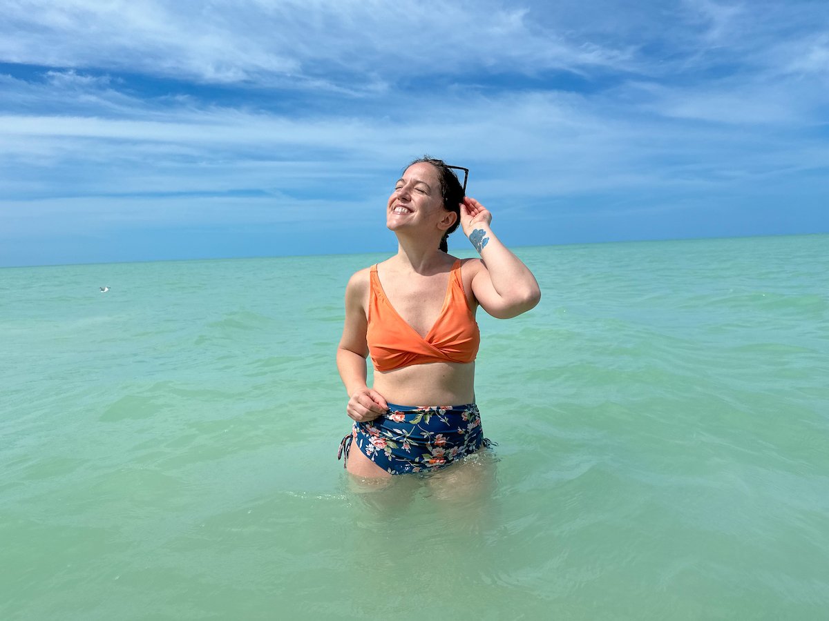 woman swimming in the clear turquoise waters of the Gulf of Mexico off Playa Holbox in Mexico
