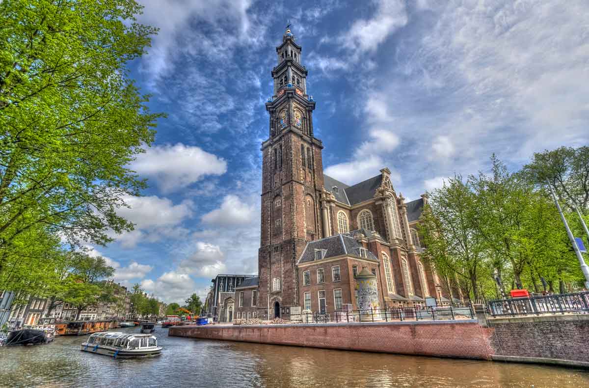 Westerkerk Church view from canal in Amsterdam.