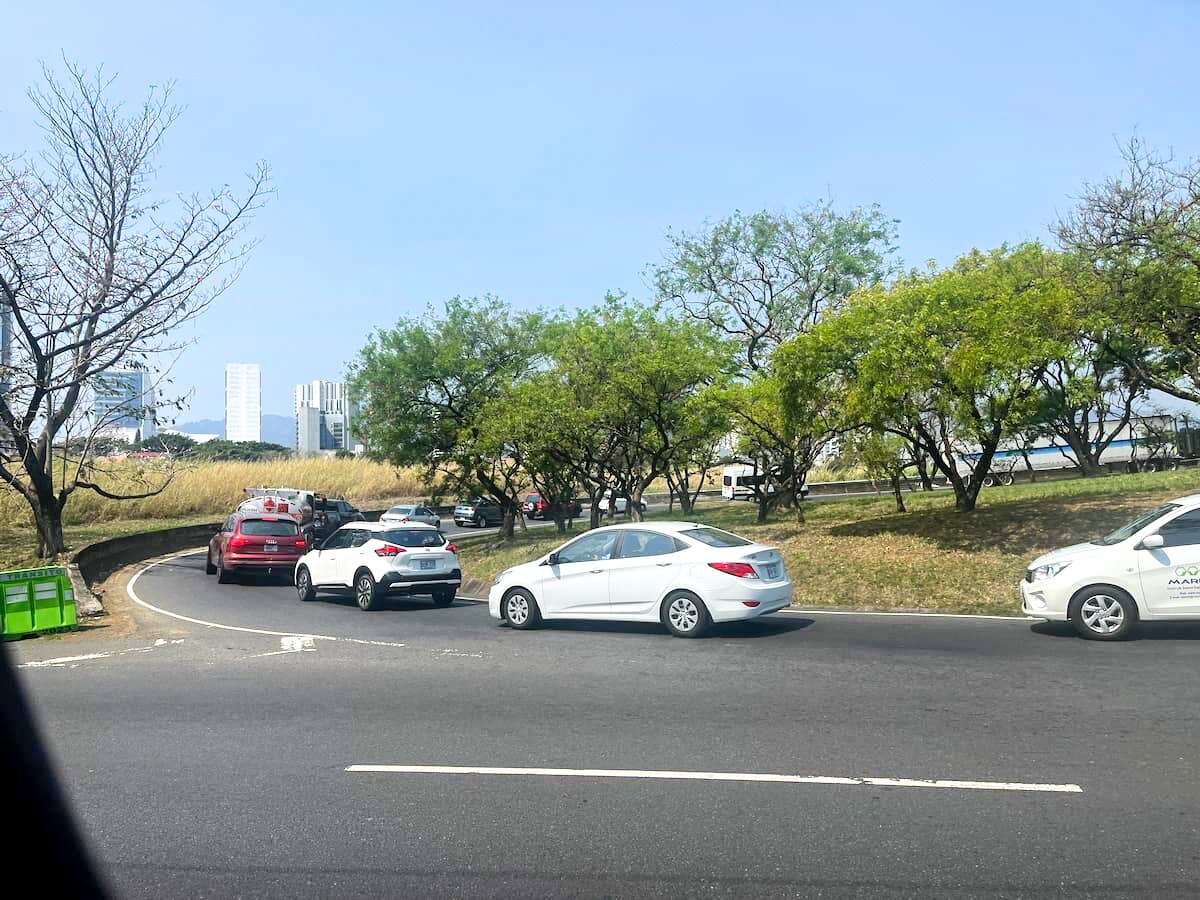 Cars stuck in traffic on a sunny day in San Jose, Costa Rica