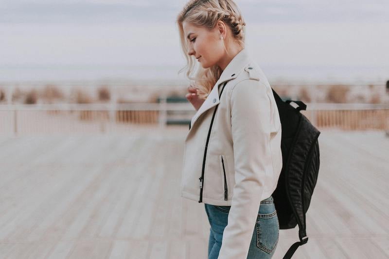 woman walking with her head down after an epic travel fail