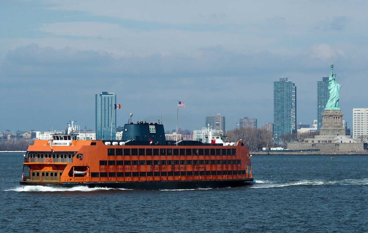 Staten Island Ferry passing by the Statue of Liberty