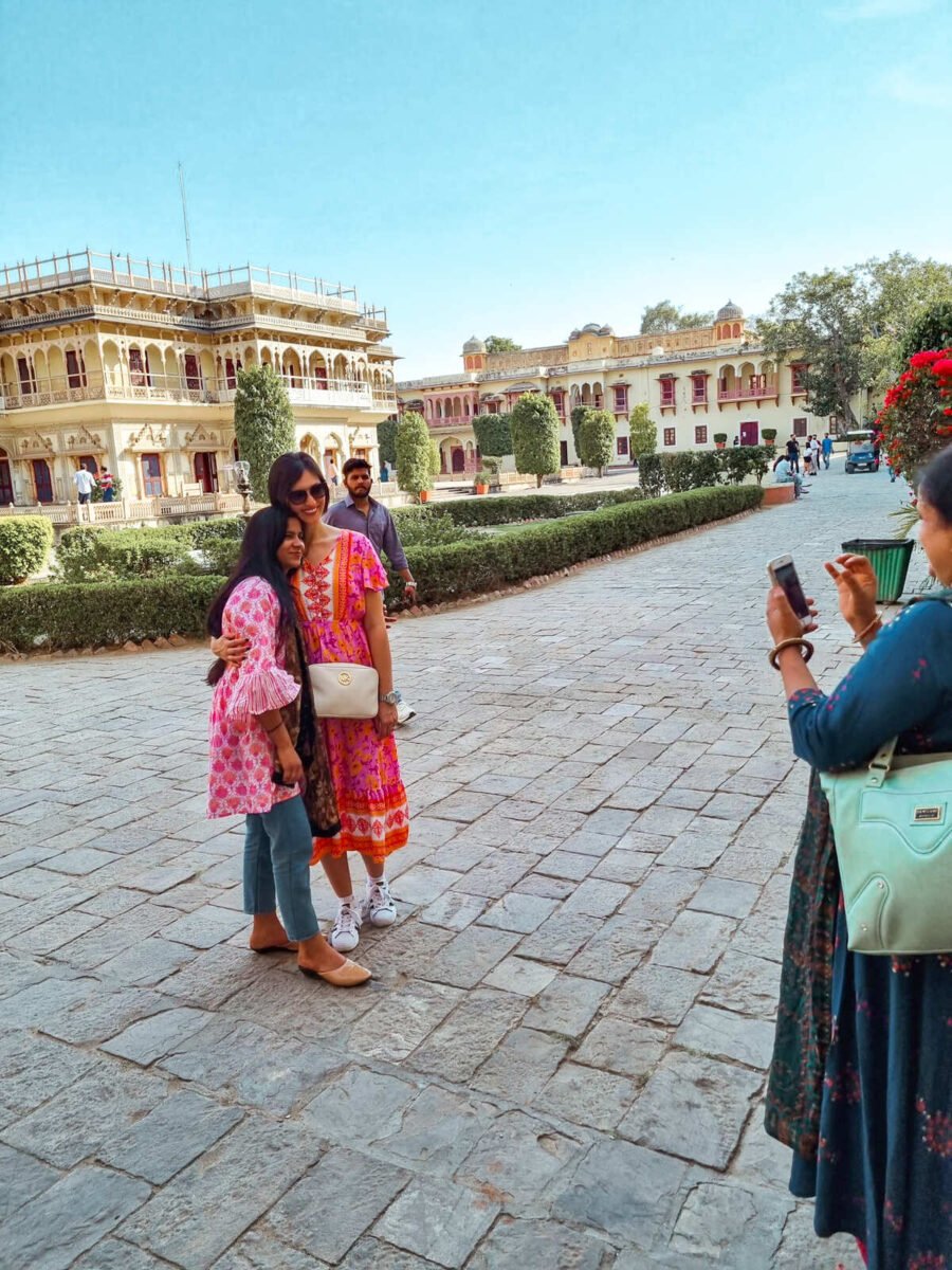 solo female traveler in Mumbai taking photos with locals