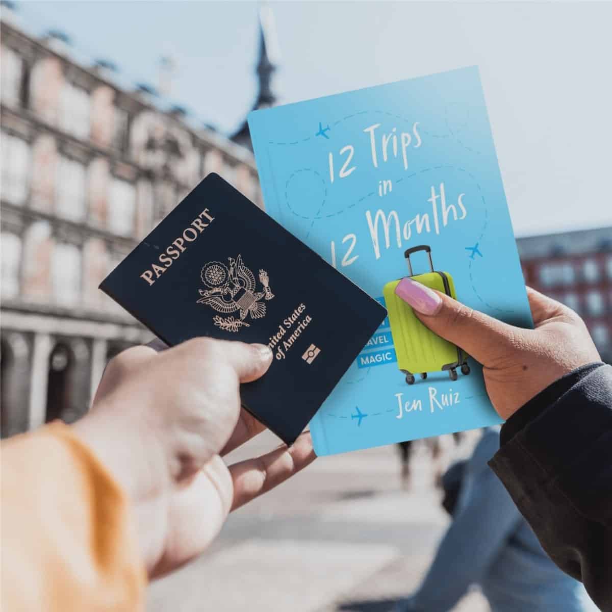 traveler holding up a copy of blogger Jen Ruiz's travel memoir, "12 Trips in 12 Months"