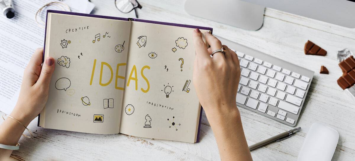 author writing her ideas down into a book proposal to try to get a book deal