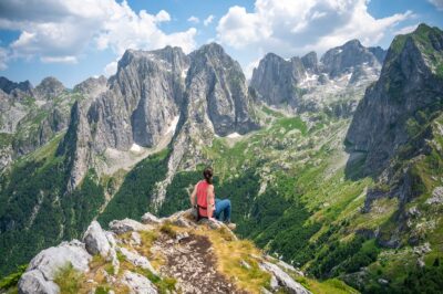 woman admiring the view in Prokletije National Park while hiking the Peaks of the Balkans trail