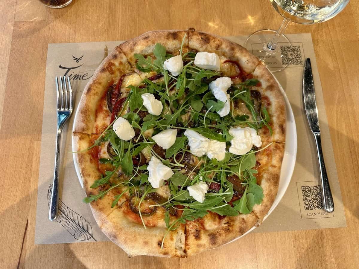 pizza topped with fresh mozzarella and basil from Time Restaurant in Tirana