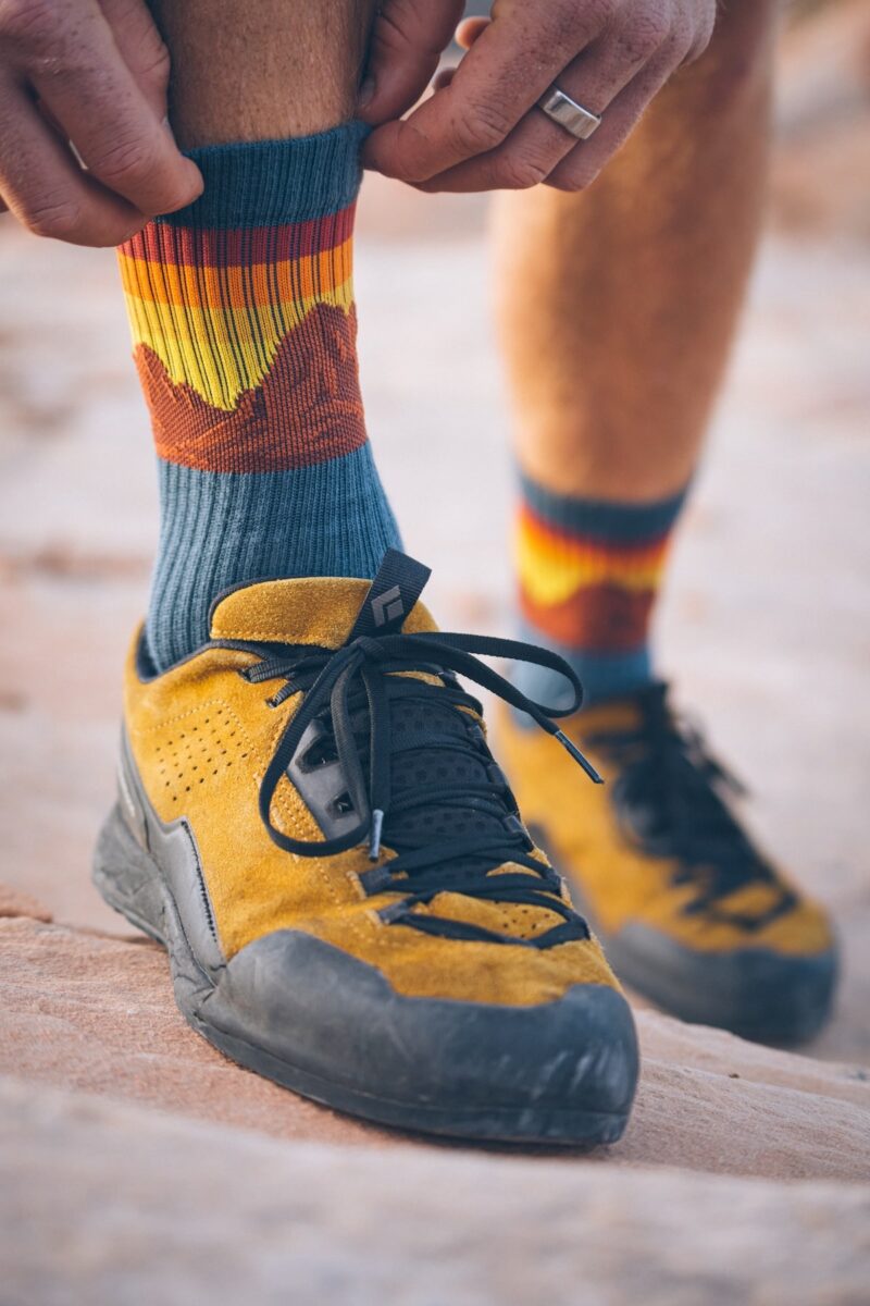 hiker stopping along the trail to pull up their Java Socks