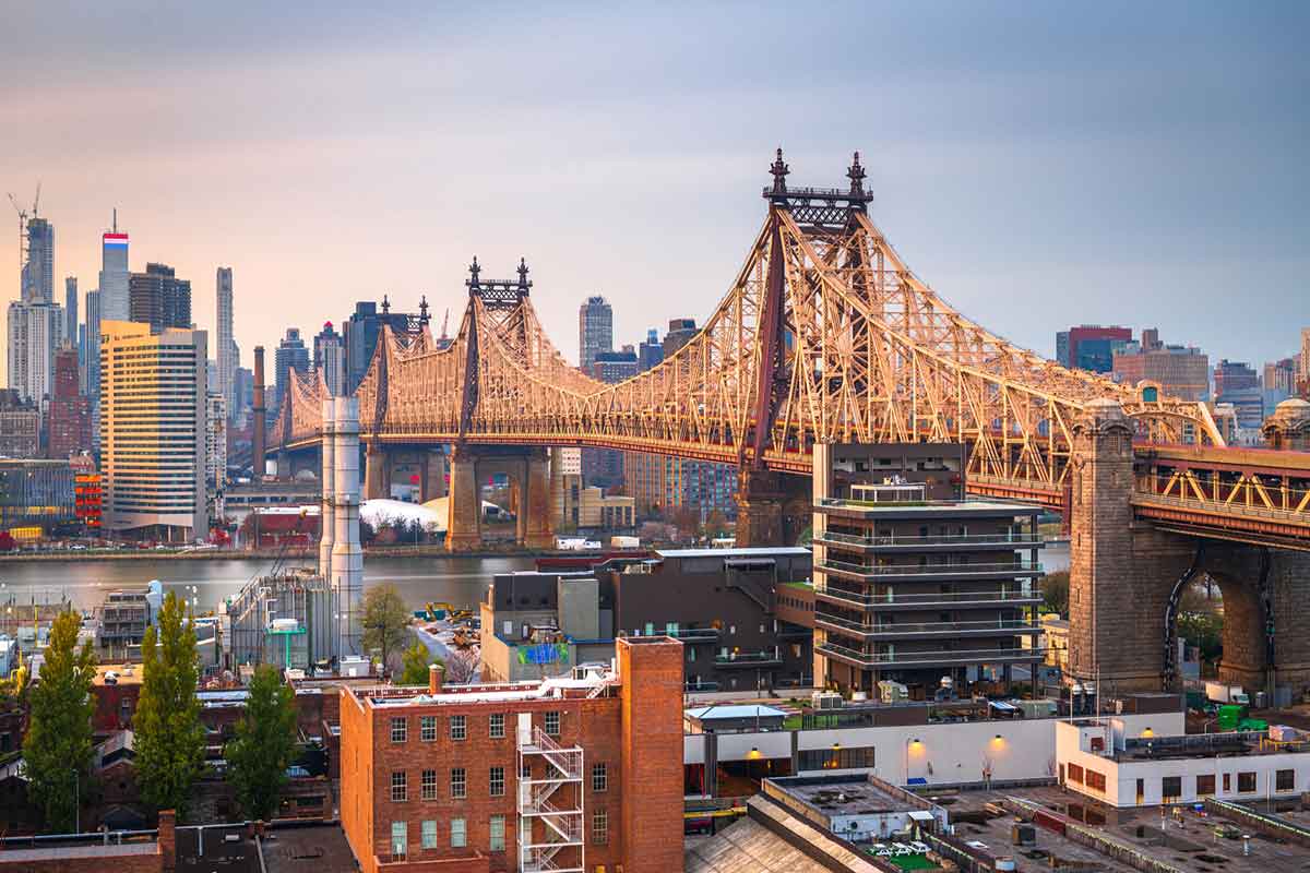 View with the Queensboro Bridge towards Manhattan at dusk.