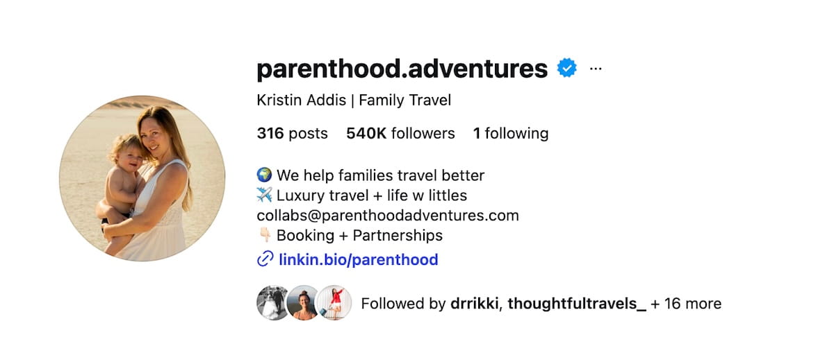 A screenshot of the Instagram profile for @parenthood.adventures, belonging to Kristin Addis. The profile features a circular profile photo of Kristin holding her young child on a beach. The bio shows over 540,000 followers and states "We help families travel better" and "Luxury travel + life w littles." It includes a linkin.bio link and a contact email for collaborations.