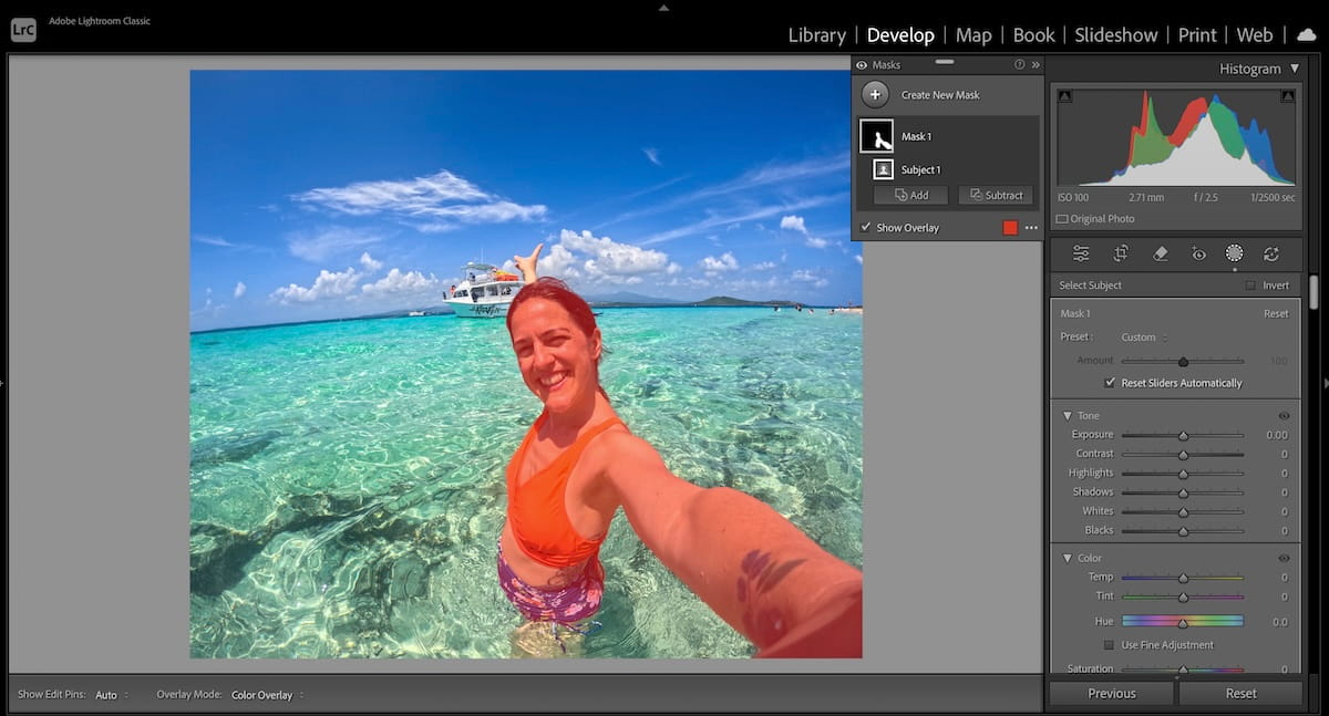 travel photograph of a woman swimming a turquoise sea being editing in Lightroom using the masking tool